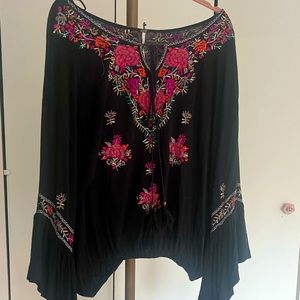 Long sleeve black free people blouse.